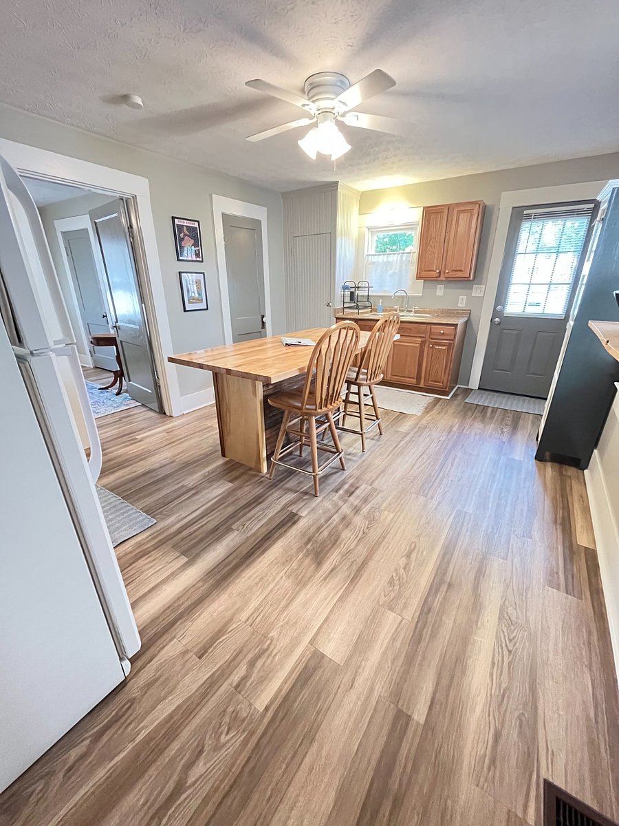 Spacious kitchen with large island for cooking and dining. (Extra stools in closet for hosting dinner guests.)