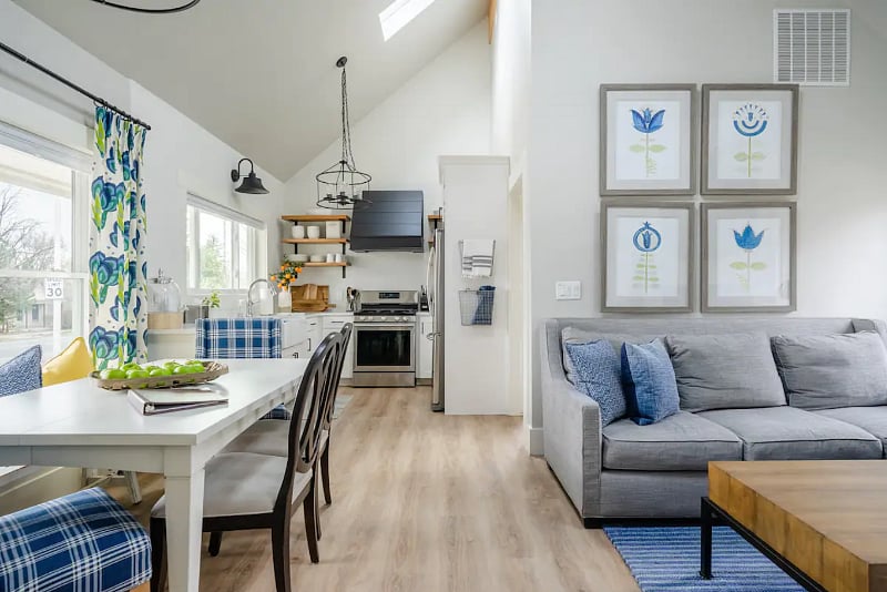 Fully equipped kitchen with an open living/dining area to gather in.