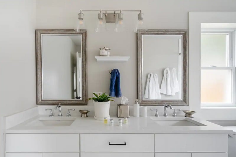 Beautiful bathroom with two sinks and a shower/tub combination.