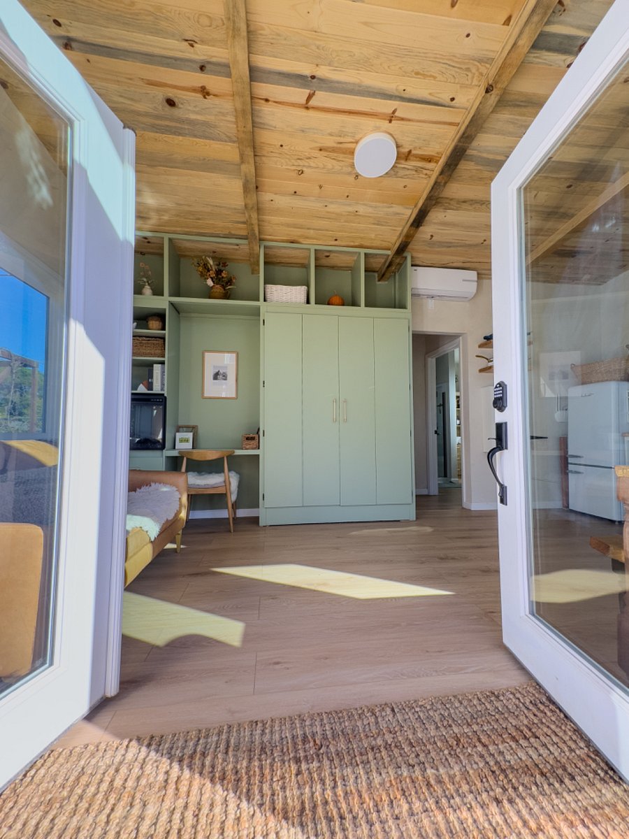 Living-room with Murphy bed hutch closed + office desk