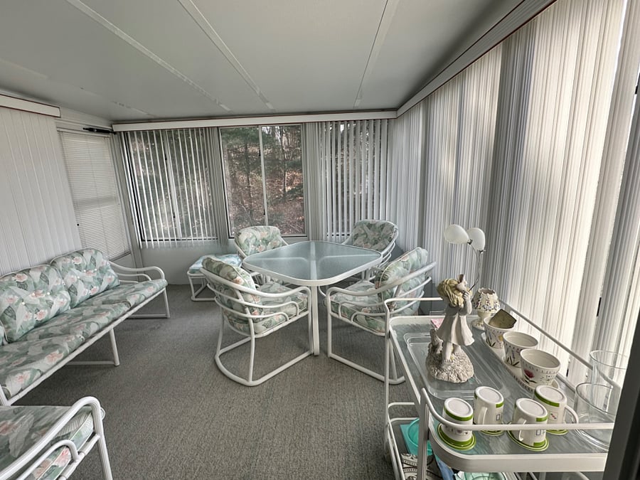 Off the dining room. Slider entrance. 3 season room. Windows do open.