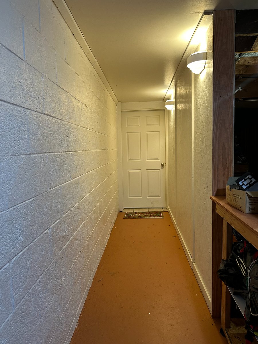 Locked separate entrance hallway to apartment in basement