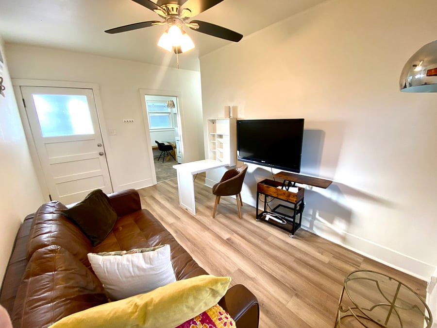 Living room with wall-desk folded down.