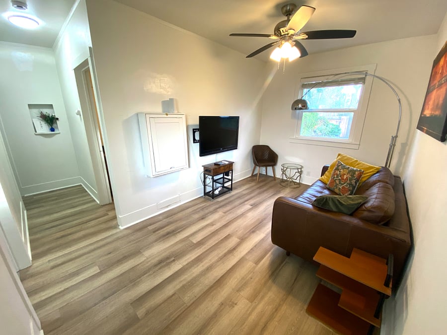 Living room with wall-desk folded up.