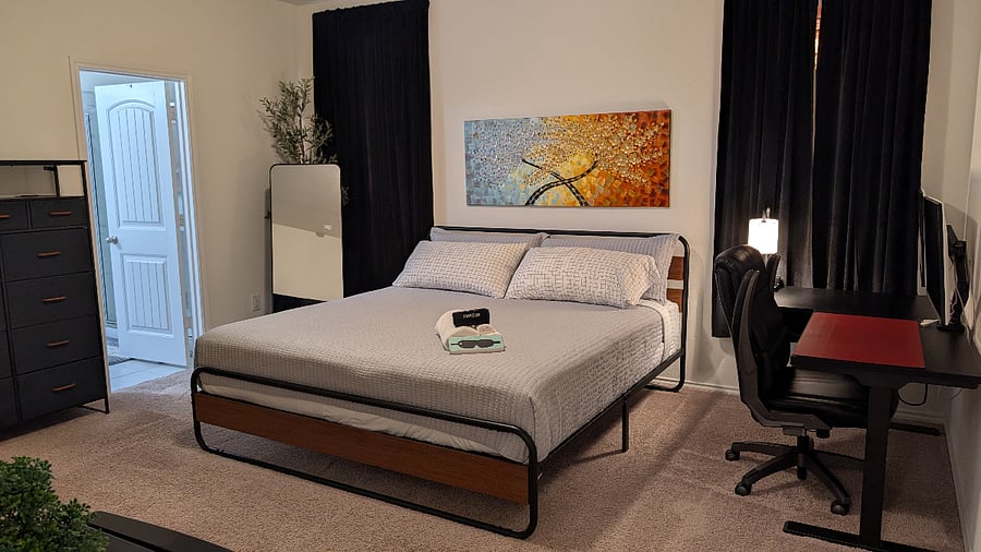 First-floor primary suite with king bed and workspace