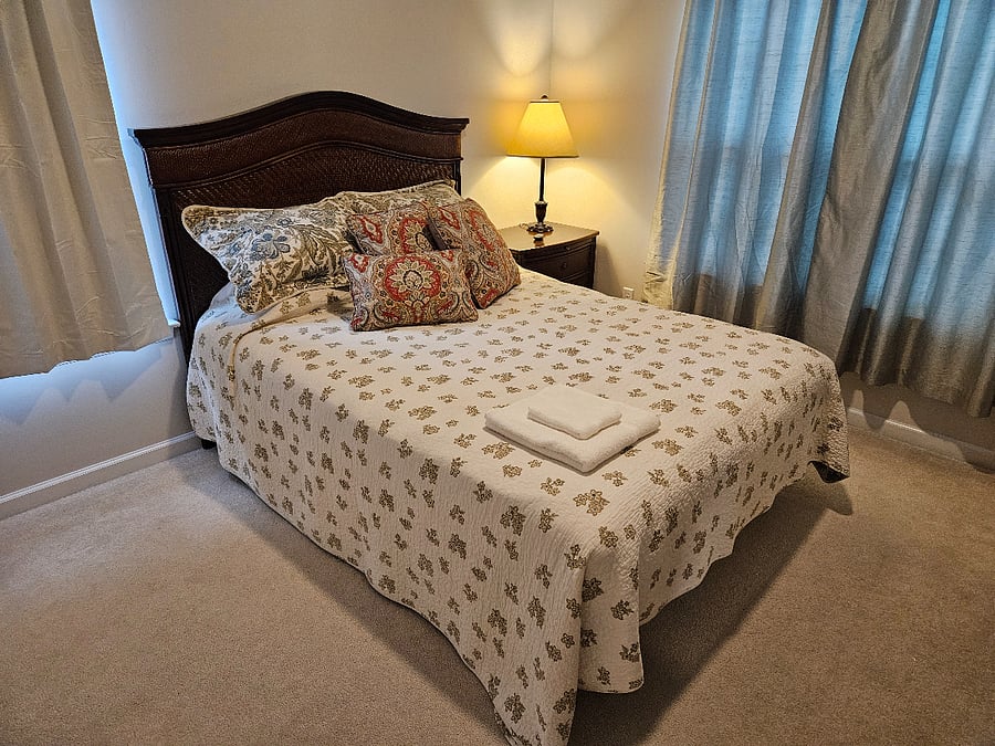 This bedroom is at the front of the house. There's a queen bedroom furniture set complete with all bedding.