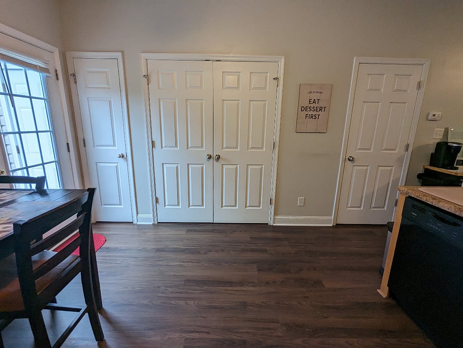 Pantry, washer and dryer closet, half bath off kitchen