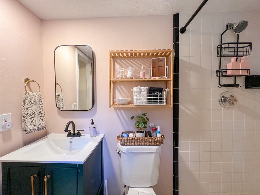 Walk in shower (no tub) and plenty of storage for your toiletries in this charming bathroom.