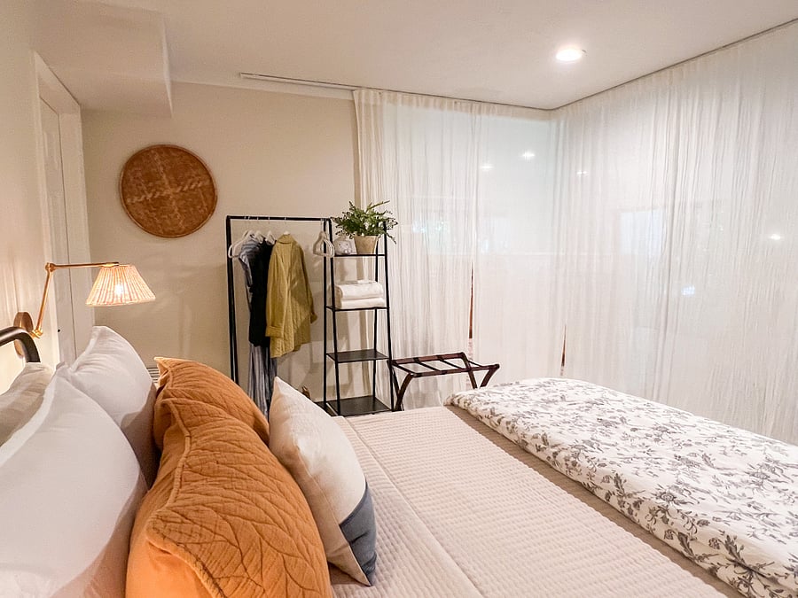 Curtains on a track system offer more privacy and separation from the rest of the space.