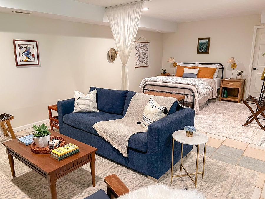 Spacious living room with sofa bed and bedroom with queen bed