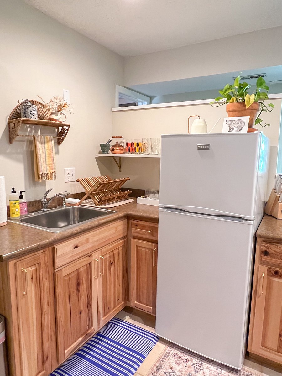 There's a medium size fridge and freezer for your food and drink. Full size sink and rack makes cleaning dishes easier.