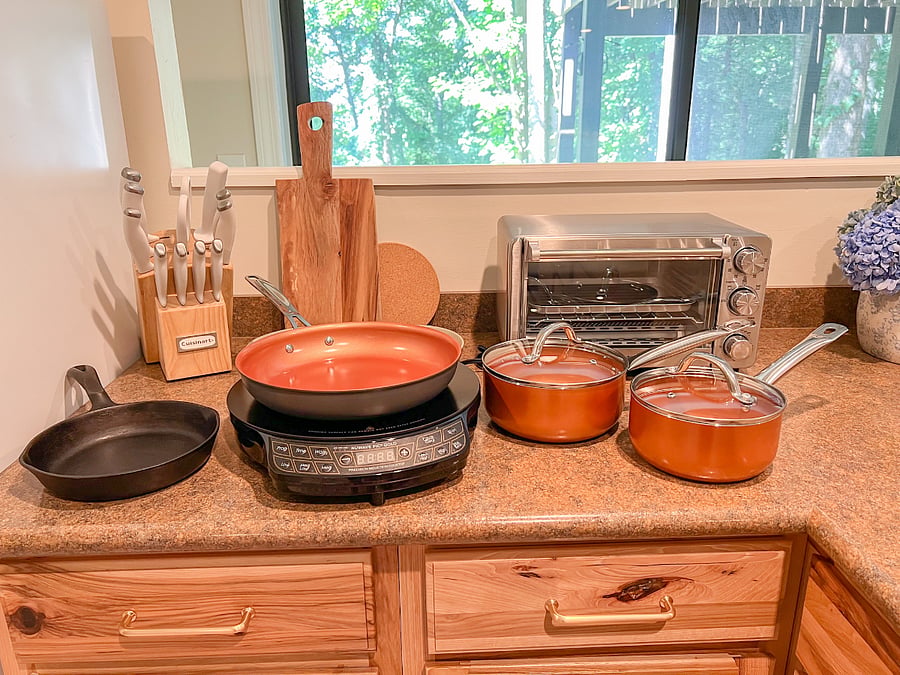 There's a plug in one pot induction stovetop and a toaster oven for your cooking needs.