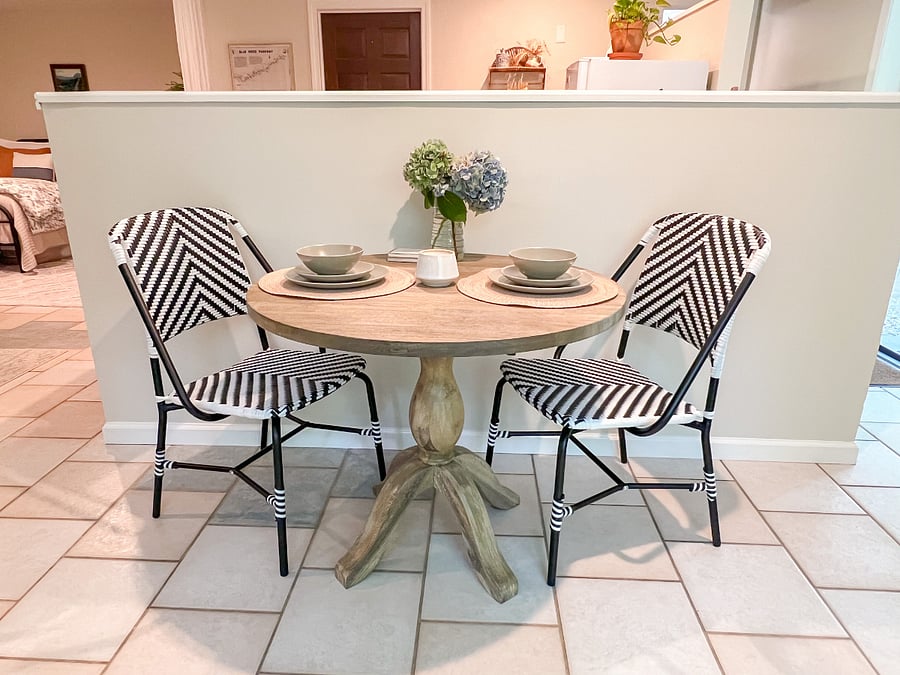 Seating area set up for two people. This area looks out onto the fenced in yard.