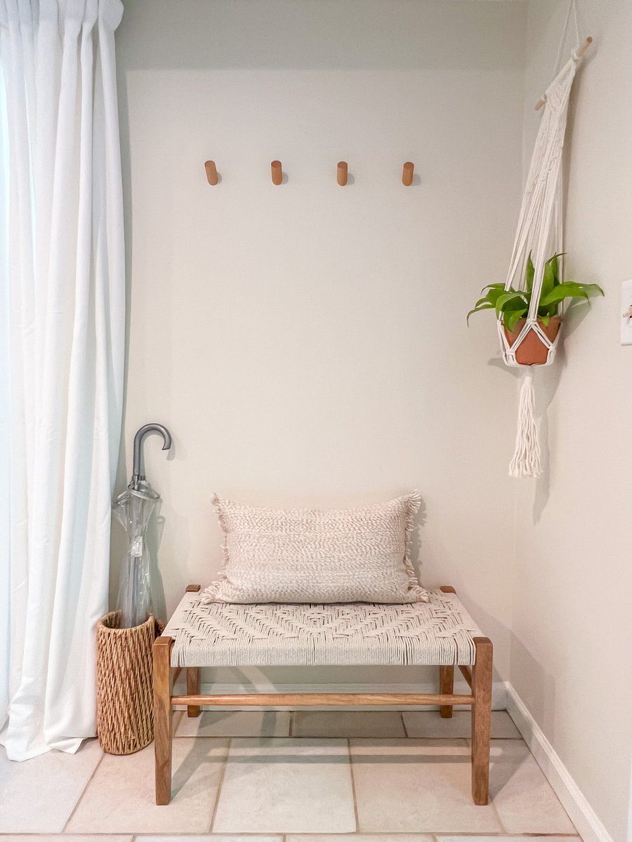Entryway area with a bench and hooks that makes coming in and out more convenient.