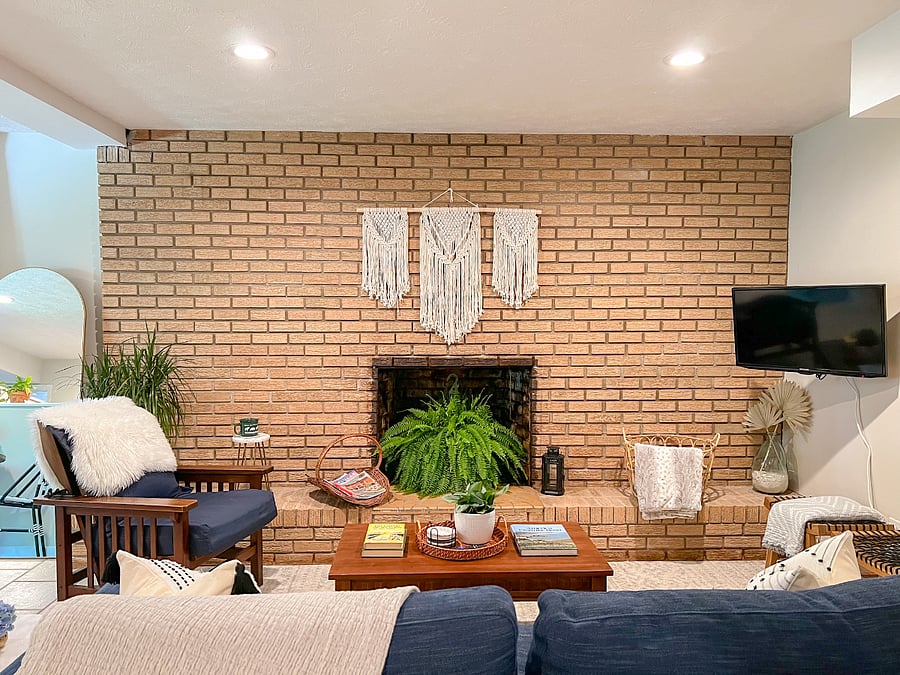View of the living room from the bed. Non working fireplace does not provide heat but it does provide ambience.