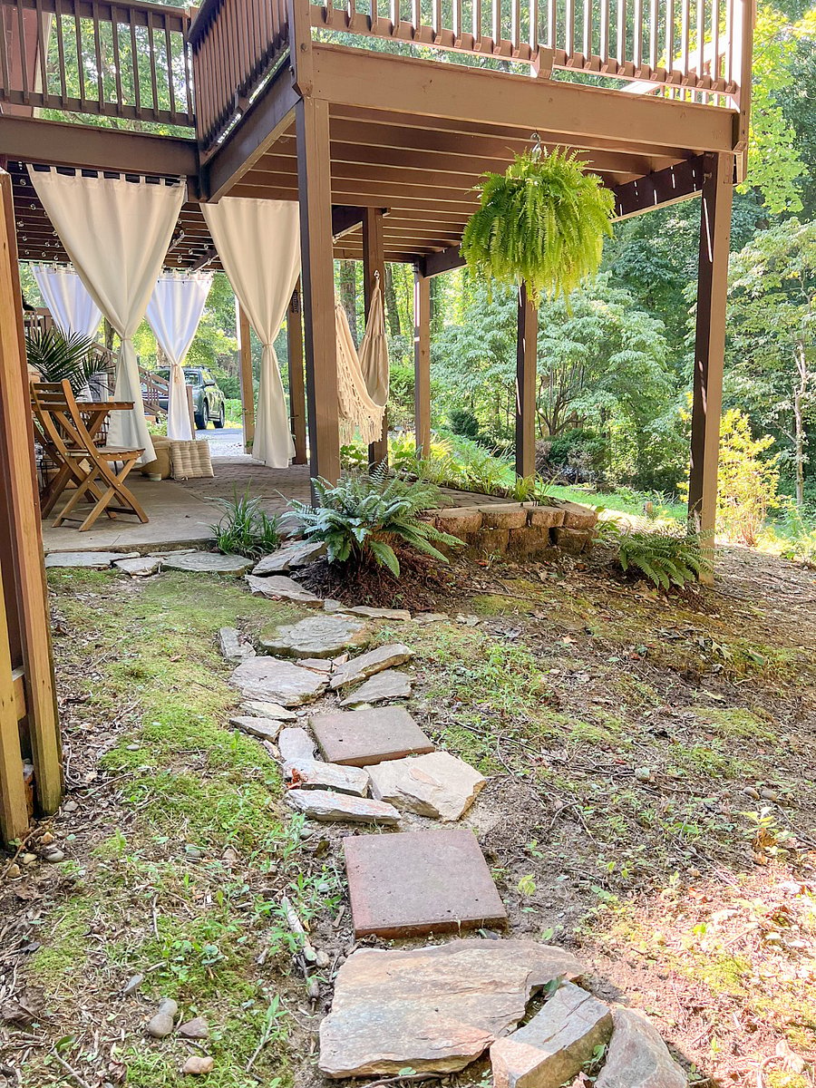 Walkway to side yard and around the corner to the outdoor fire pit.
