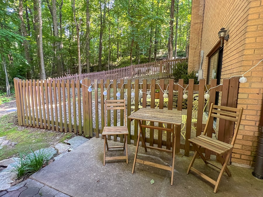 Plenty of outdoor seating and stringed lights for ambience. There's also a dry box to hold all cushions and the hammock.