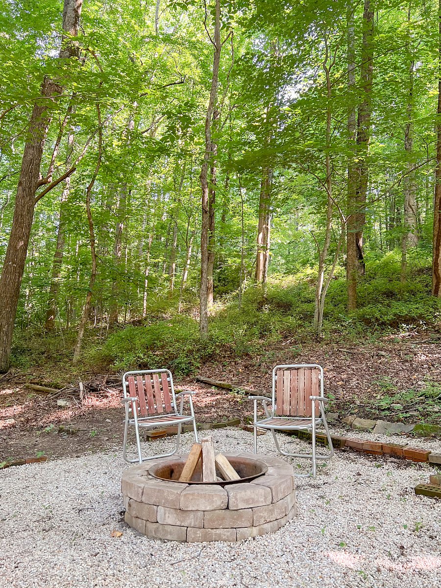 Outdoor fire pit area with stringed lights.