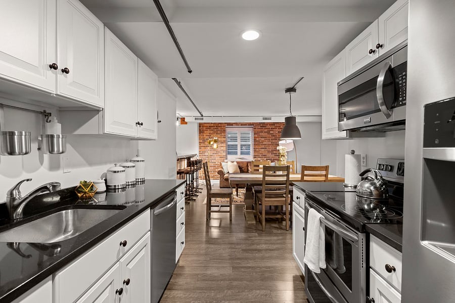 Modern, clean, fully equipped kitchen with stainless steel appliance