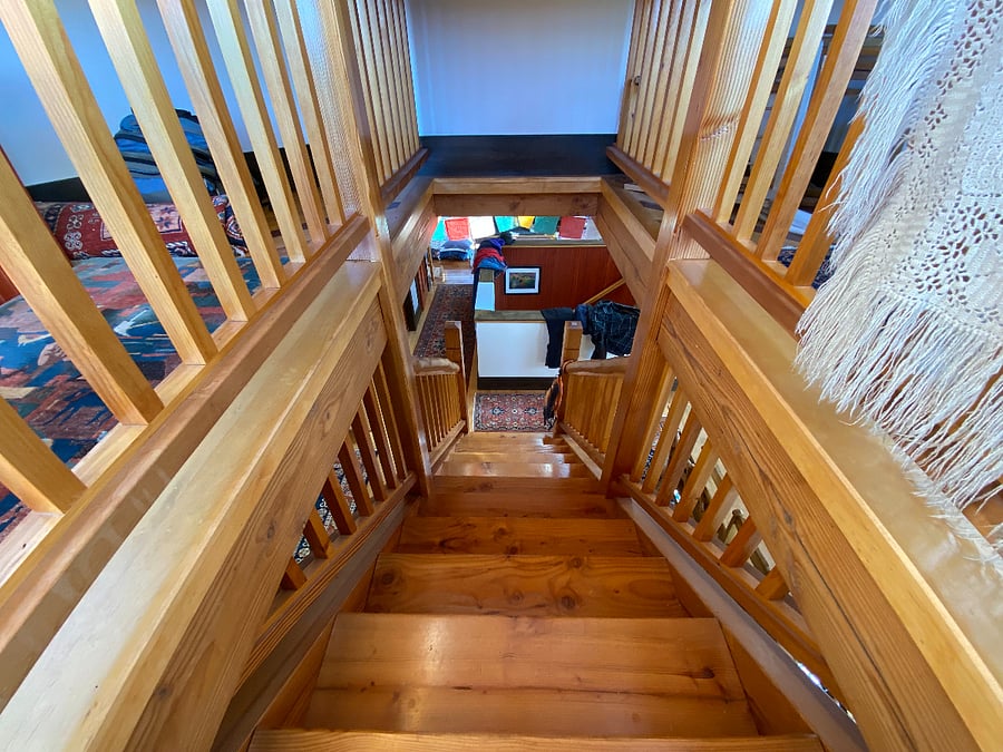 Stairs leading to the porch and top floor