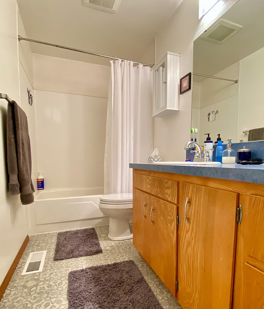 New magnetic wand-style shower head. Extra towel rack and lots of cabinet space for things.