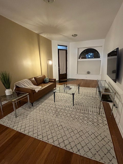 Smart TV in the living room
10 foot tall ceilings and bamboo floors give the renovated historical landmark charm
