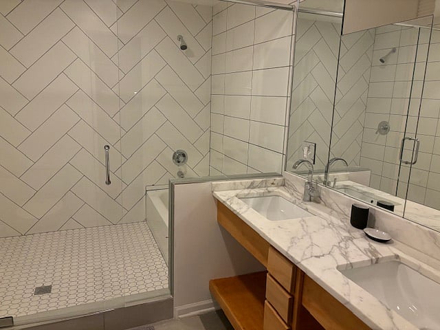 ensuite bathroom with double shower and double vanity
