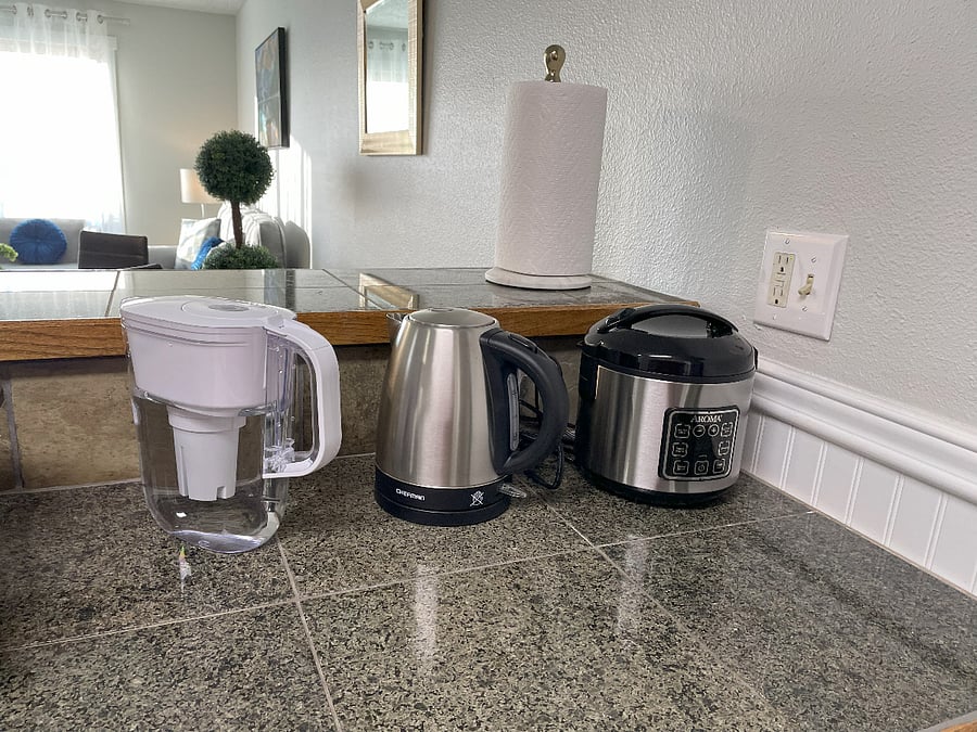 Water pitcher with filter, electric water heater, and rice cooker/steamer.