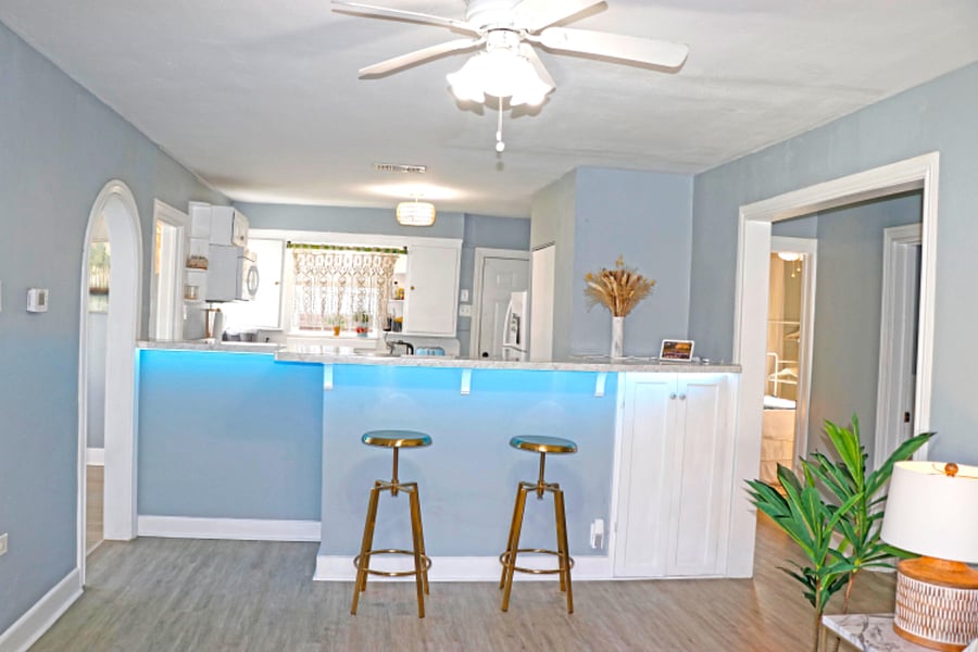 Brass stools & counter provide additional dining options.