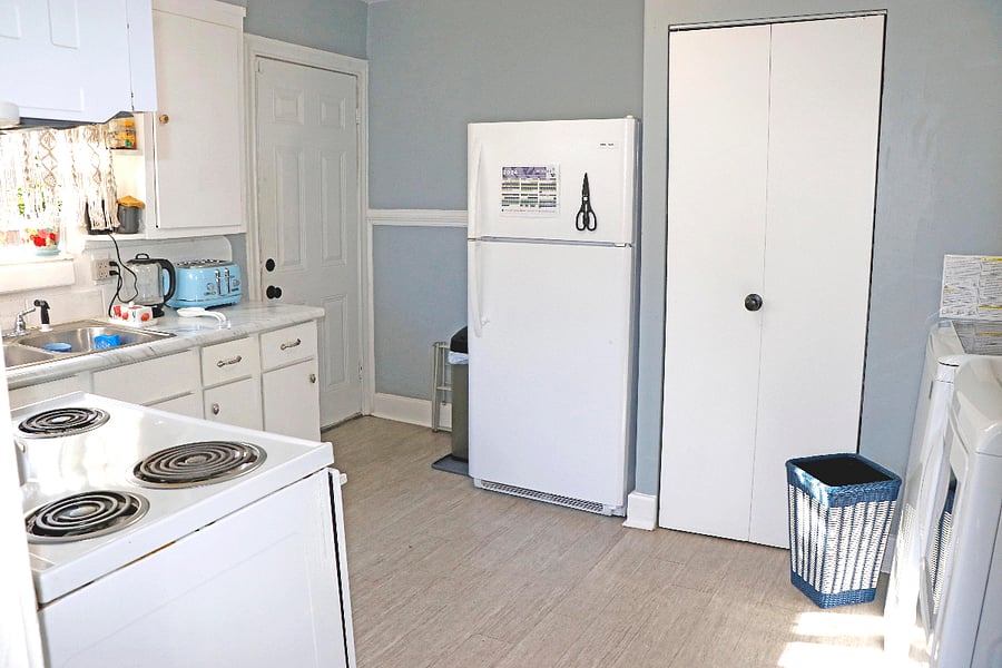 Full-sized fridge. Pantry has plastic bags, paper towels, disposable plates, & cleaning supplies. 