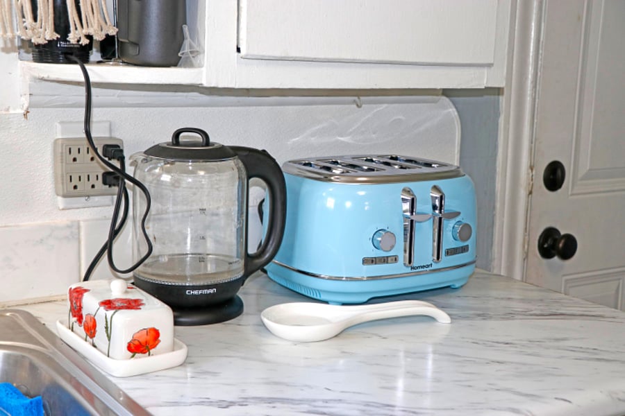 Kettle & 4 slice toaster are some of the kitchen essentials available in this fully equipped kitchen. 
