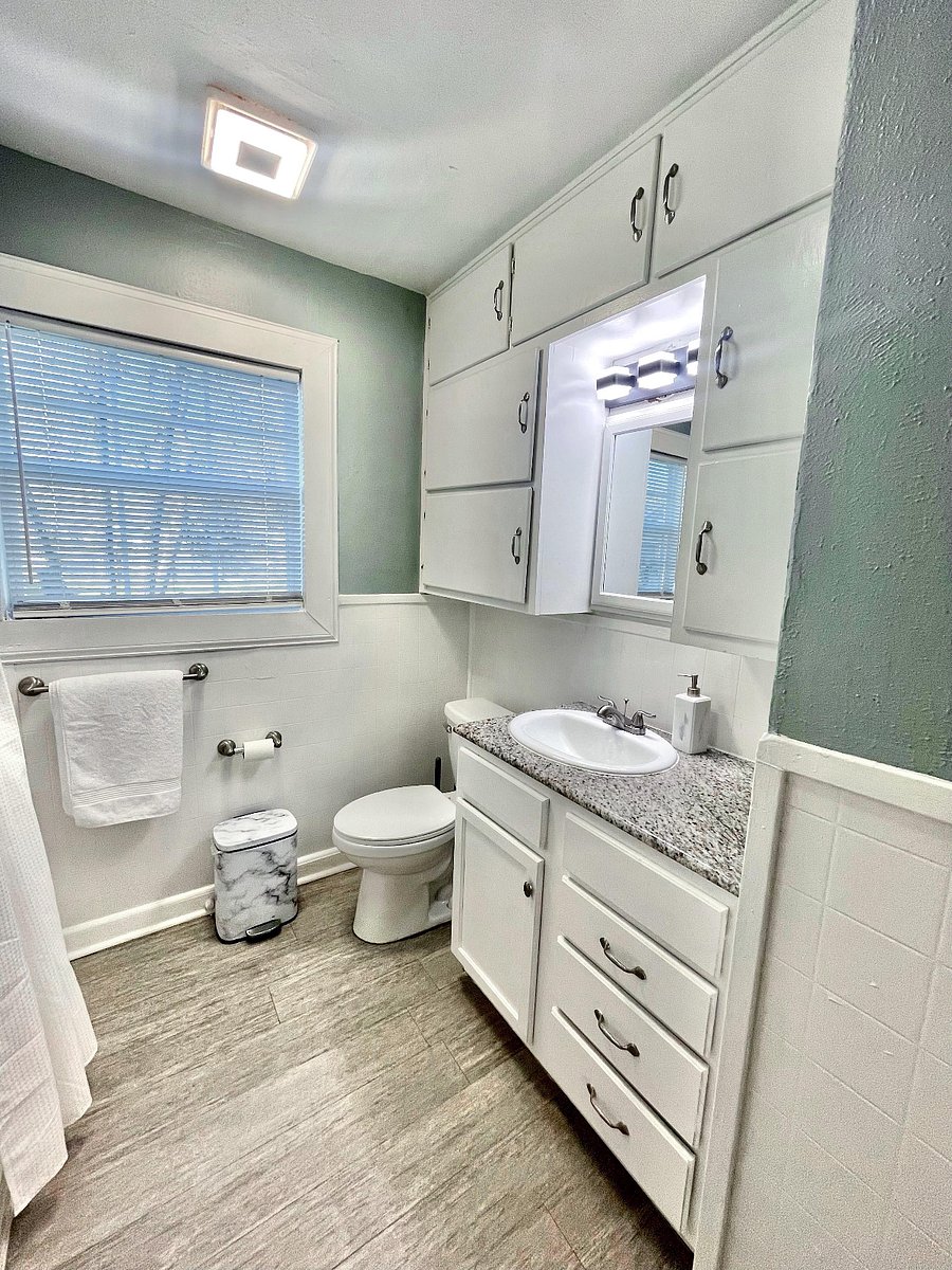 Towels, bath mats, and starter bath essentials provided.