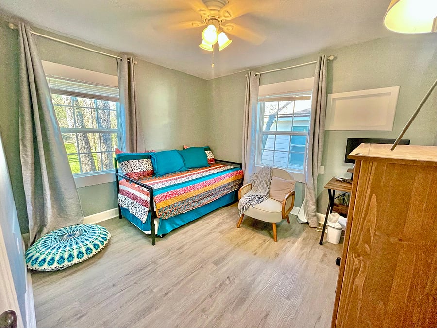 This office/bedroom has a twin sized daybed that has a pull-out trundle with another twin mattress.