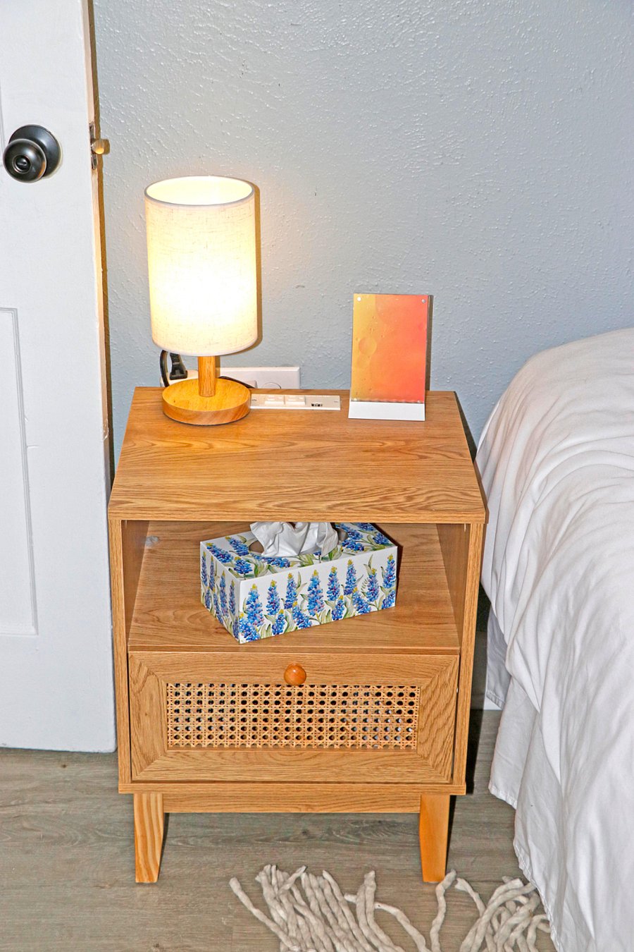 Nightstand has outlets, USB ports & even a standing wireless phone charger.