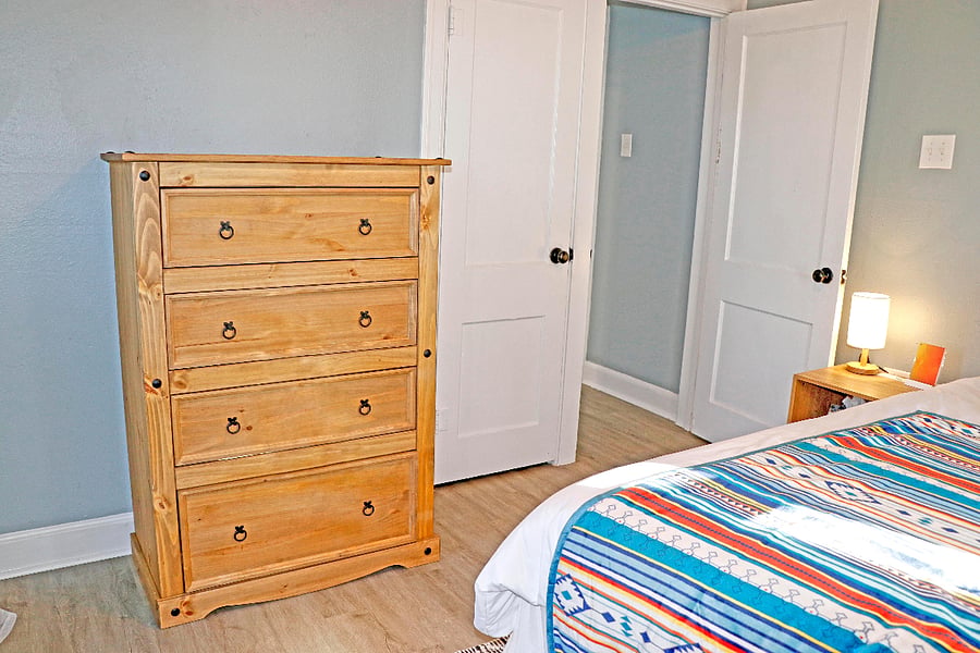 Solid wood 4-drawer dresser.
