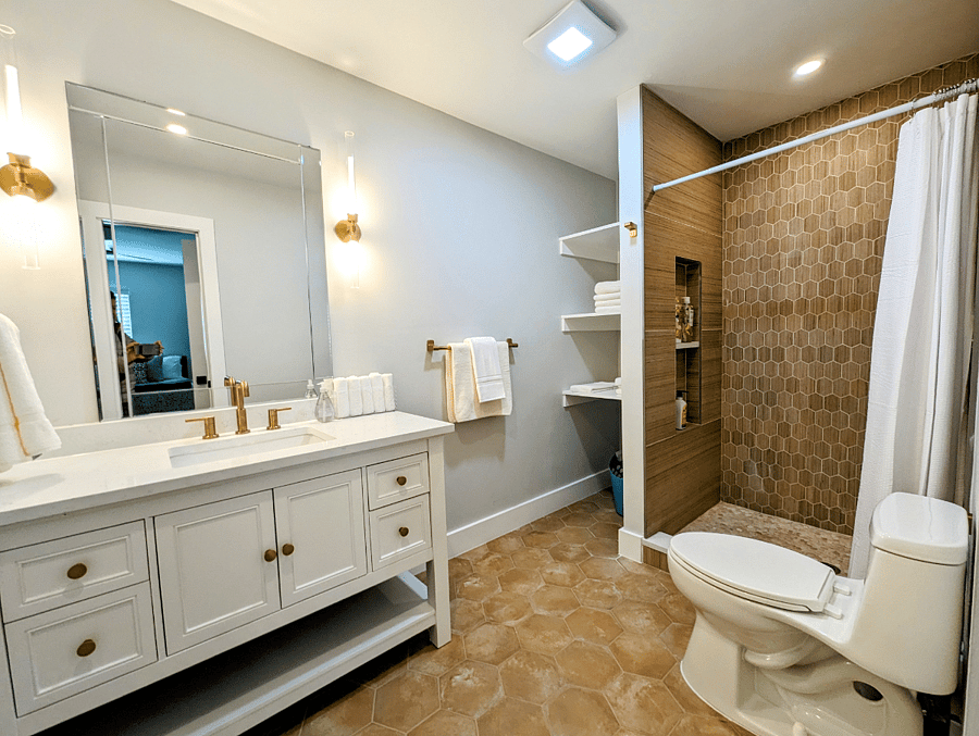 Primary bath within bedroom 2, newly renovated.