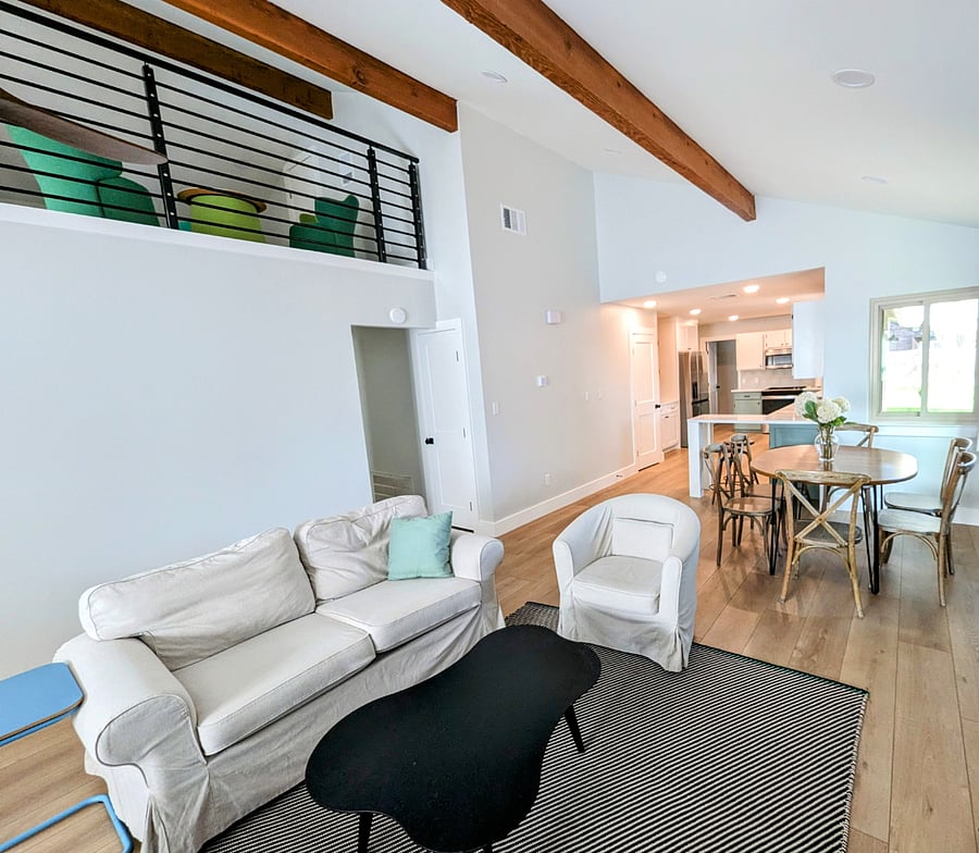 Bright living room that opens to dining area and spacious kitchen