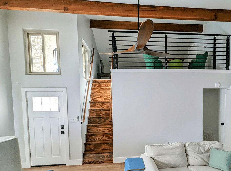 Ladder stairs to spacious loft with sofa that can be used as a twin bed.  Ideal space for working from home