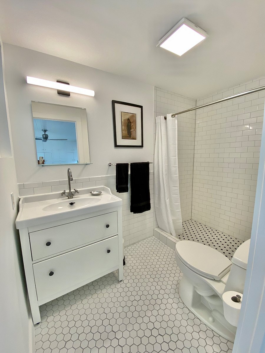 Fully stocked bathroom with blow-dryer, first aid kit, towels, wash cloths, soap, shampoo, shower stool.