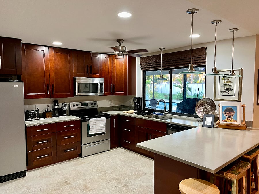 Plenty of cabinet space for private use, all necessary appliances and utensils with concrete counters and locally purchased artwork.