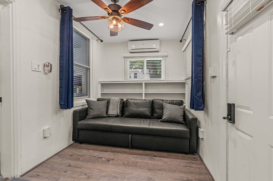 Lockable back porch room converts into a fourth bedroom with pullout sleeper. You decide whether to keep it as a reading room or an bedroom with en-suite for your stay. All entrances have shoe racks and couches for your comfort.