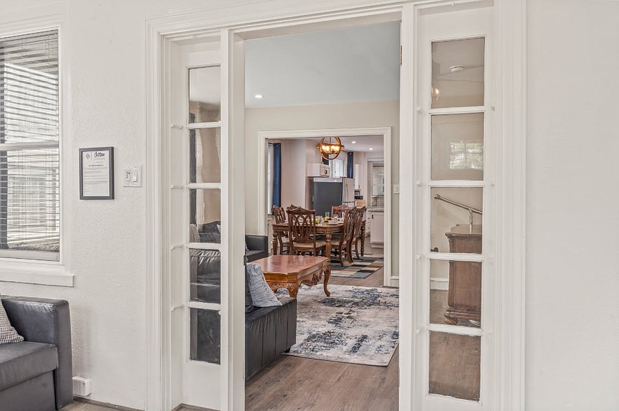 Open the front porch door to reveal a long open floor plan: living room connects to the dining room and kitchen with back porch at the very end. Perhaps that telescope will come in handy after all!