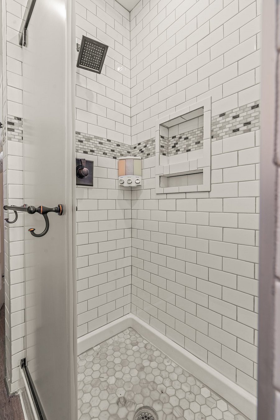 Refresh in our central full bathroom with sink, toilet and shower. 