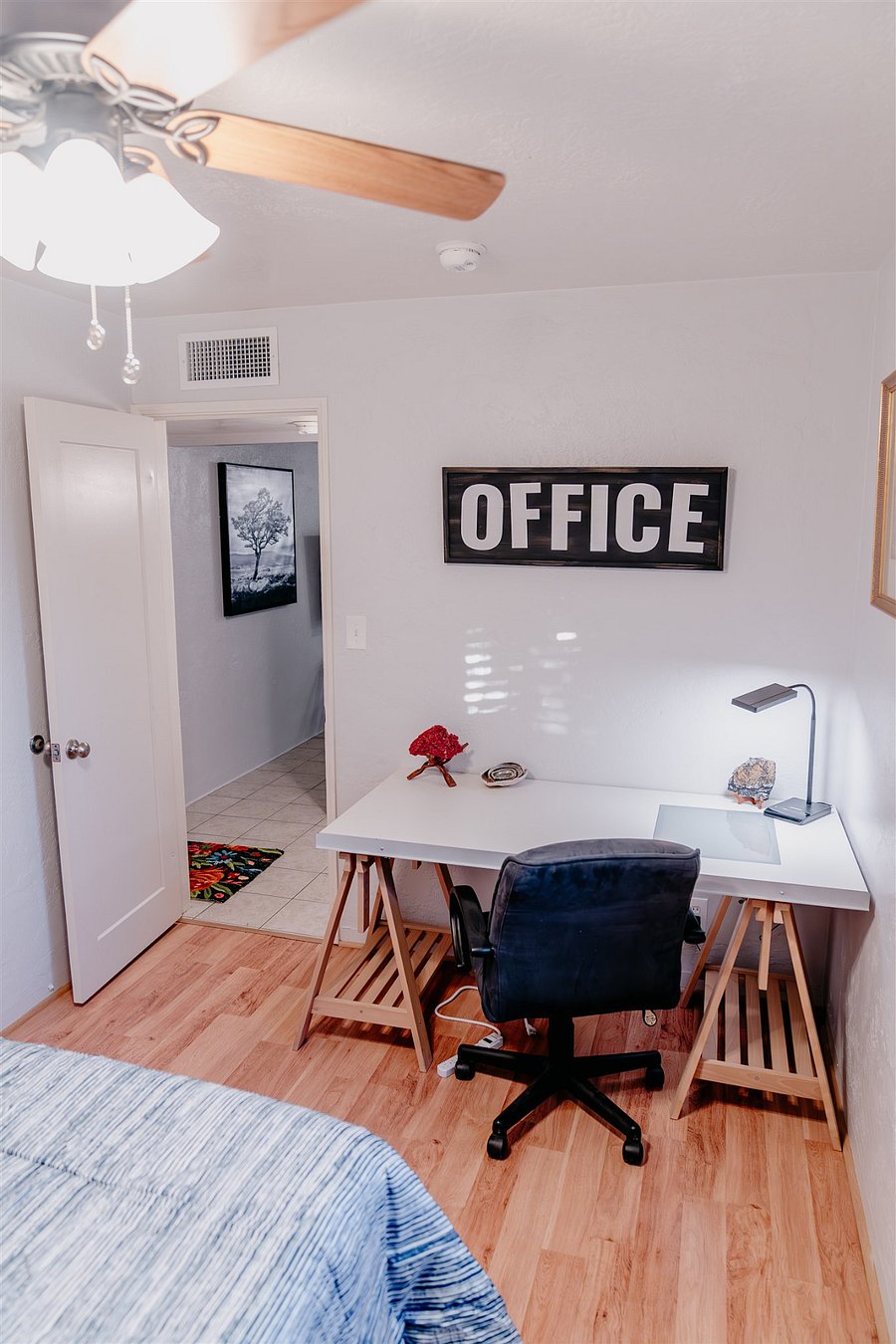 Office area in same room as single bed