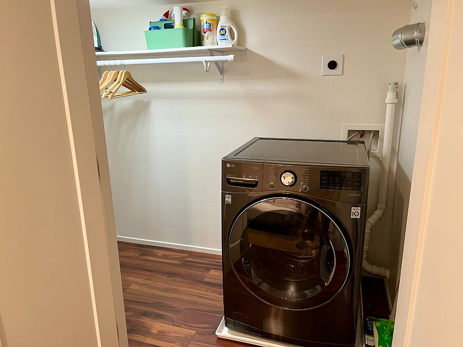 LG washer/dryer combo unit located in bedroom closet