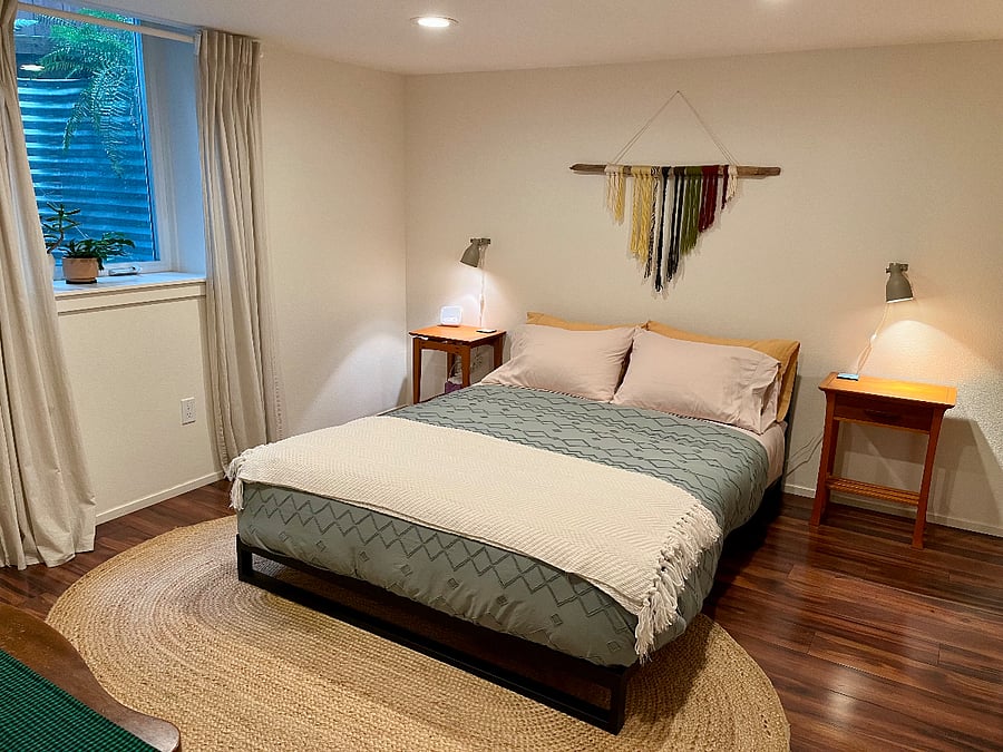 Separate bedroom with comfortable queen-size bed (plus full closet with washer/drier combo unit)