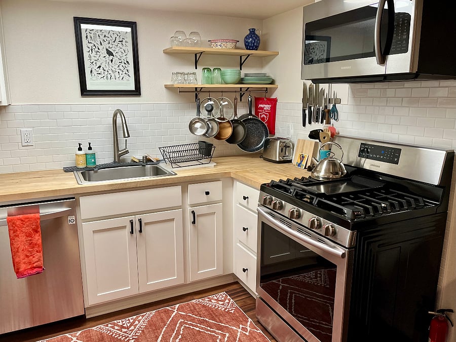 Fully equipped kitchen with gas range/oven, microwave, dishwasher, fridge/freezer, cookware and dishes