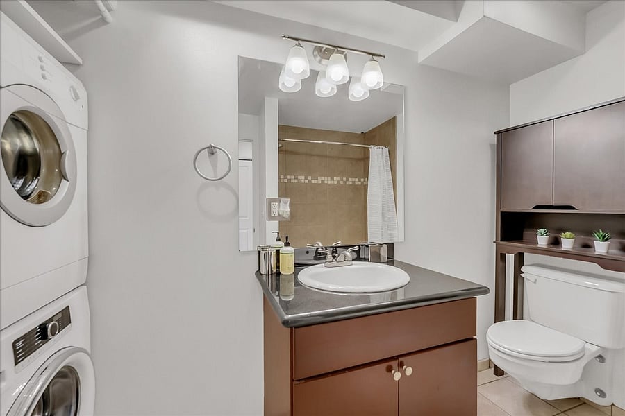 Full bathroom with laundry.