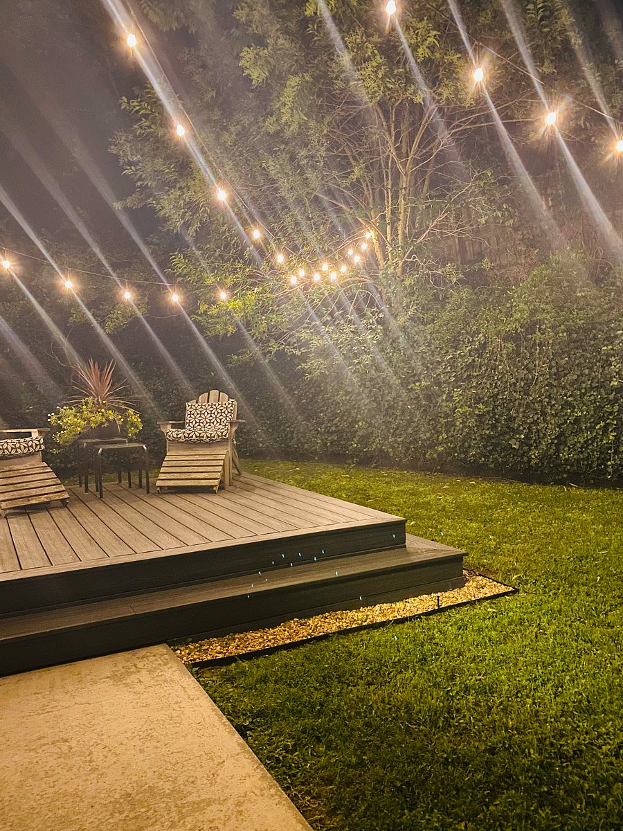 Trex decking in private backyard with string lights