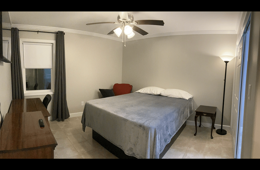 Standard Suite: bed, bedside table, sitting chair, dresser, desk and office chair, WiFi TV. Private bathroom.